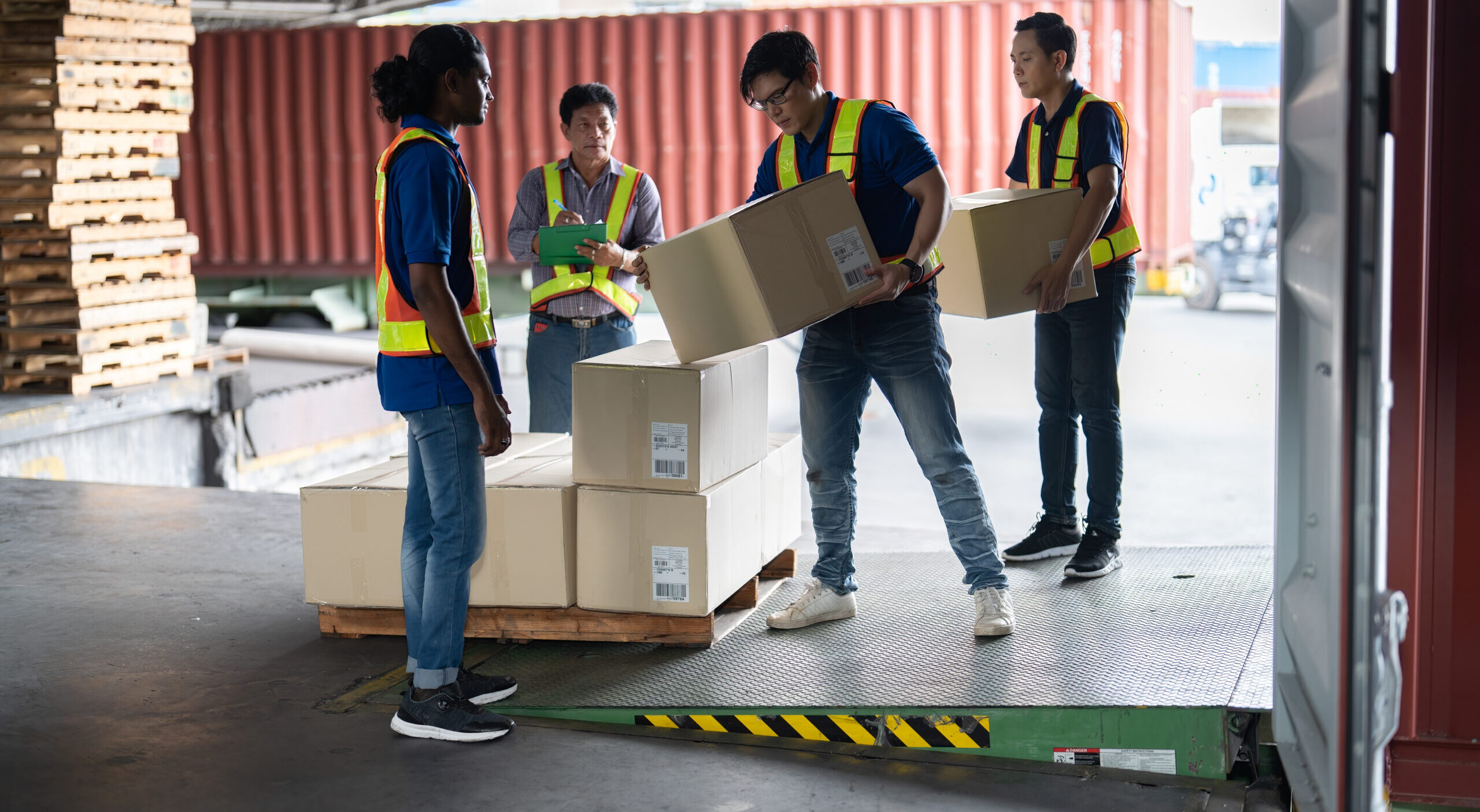 Workers open steel 40 feet container doors carry box supervisor standing check paper checklist